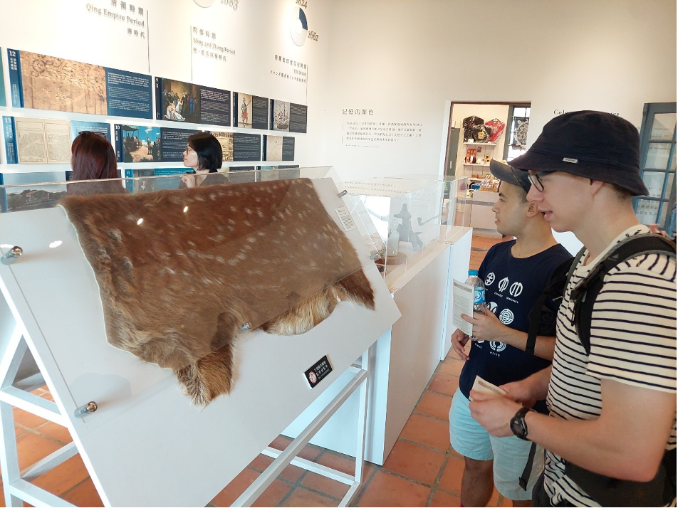 Josiah Spain and Tobias Larkin looked at a piece of deerskin, a key export commodity during Dutch colonization.